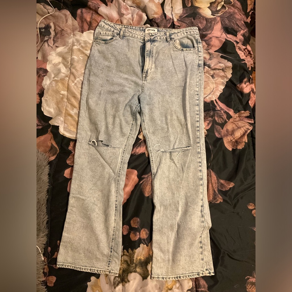 Light blue distressed denim jeans